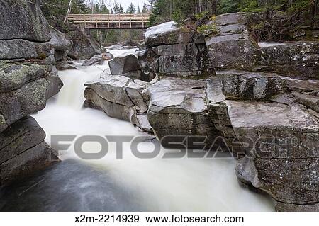 Upper Ammonoosuc Falls, which are located along the Ammonoosuc River in the Crawfords Purchase, New Hampshire USA during the spring months. View Large Photo Image Stock Photo - Upper Ammonoosuc Falls, which are located along the Ammonoosuc River in the Crawfords Purchase, New Hampshire USA during the spring months.. Fotosearch