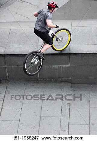 Urban bike trial View Large Photo Image Stock Photo - Urban bike trial. Fotosearch