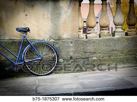 urban picture of a bicycle leaning against the wall View Large Photo Image Stock Photo - urban picture of a bicycle leaning against the wall. Fotosearch