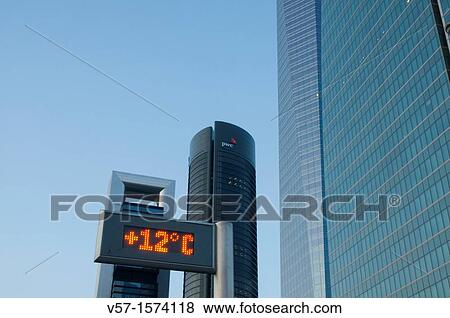 Urban thermometer and Four Towers, Paseo de la Castellana. Madrid, Spain. View Large Photo Image Stock Photo - Urban thermometer and Four Towers, Paseo de la Castellana. Madrid, Spain.. Fotosearch