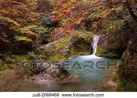 Urederra River rises in the southern slopes of the Natural Park of the Sierra de Urbasa and Andia. The way to its source is flanked by a centenary beech forest. View Large Photo Image Stock Photo - Urederra River rises in the southern slopes of the Natural Park of the Sierra de Urbasa and Andia. The way to its source is flanked by a centenary beech forest.. Fotosearch