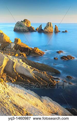 Stock Photo - Urros de Liencres rocky isles, Costa Quebrada, Pi? lagos, Cantabria, Spain. Fotosearch