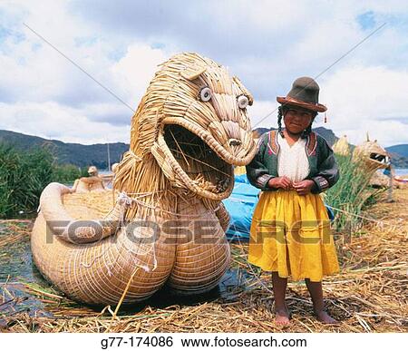 Uru indian girl and totora reeds boat. Titicaca Lake. Peru View Large Photo Image Stock Photograph - Uru indian girl and totora reeds boat. Titicaca Lake. Peru. Fotosearch