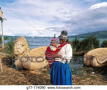 Uru indian mother and child and totora reeds boat. Titicaca Lake. Peru View Large Photo Image Stock Image - Uru indian mother and child and totora reeds boat. Titicaca Lake. Peru. Fotosearch