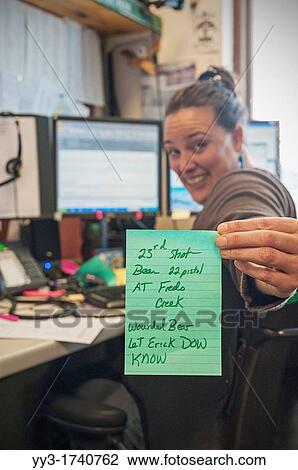 US Forest Service dispatcher holds up message for field workers - warning of wounded bear in their work area on the Tongass National Forest, Alaska, USA View Large Photo Image Stock Image - US Forest Service dispatcher holds up message for field workers - warning of wounded bear in their work area on the Tongass National Forest, Alaska, USA. Fotosearch