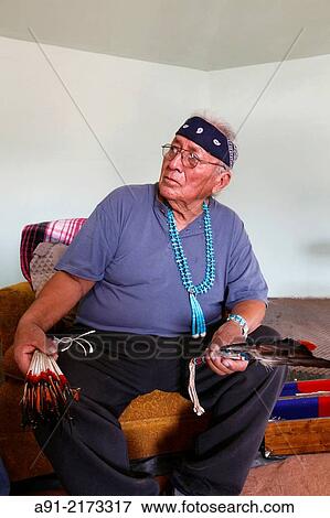 Stock Photo - USA, Arizona, Navajo reservation, Monument Valley tribal park, Stanley Holiday, medicine man, 78 years, holds a blessing ceremony in his hogan. Fotosearch