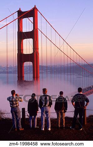 USA, CALIFORNIA, SAN FRANCISCO, GOLDEN GATE BRIDGE WITH FOG ROLLING IN, TOURISTS. View Large Photo Image Stock Photo - USA, CALIFORNIA, SAN FRANCISCO, GOLDEN GATE BRIDGE WITH FOG ROLLING IN, TOURISTS.. Fotosearch