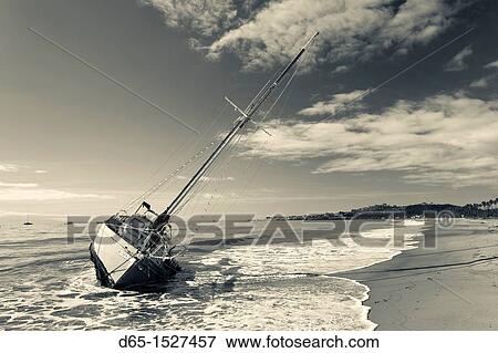 Stock Photo - USA, California, Southern California, Santa Barbara, storm wrecked yacht, East Beach. Fotosearch
