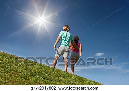 Usa. Florida. Miami Beach. Couple on a green meadow. View Large Photo Image Stock Image - Usa. Florida. Miami Beach. Couple on a green meadow.. Fotosearch