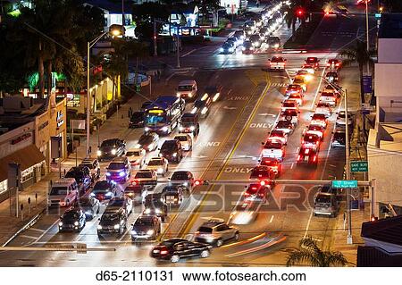 Stock Image - USA, Florida, Miami Beach, elevated view of Alton Road traffic, dusk.. Fotosearch