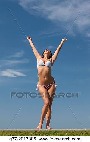 Usa. Florida. Miami Beach. Woman jumping on a beach. View Large Photo Image Stock Photography - Usa. Florida. Miami Beach. Woman jumping on a beach.. Fotosearch