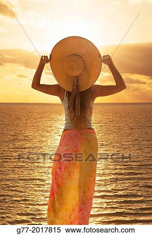 Usa. Florida. Miami Beach. Woman watching sunset. View Large Photo Image Stock Photography - Usa. Florida. Miami Beach. Woman watching sunset.. Fotosearch