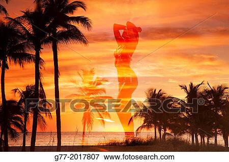 Usa. Florida. Miami Beach. Woman's shilouette against sunset on a beach. View Large Photo Image Stock Photo - Usa. Florida. Miami Beach. Woman's shilouette against sunset on a beach.. Fotosearch