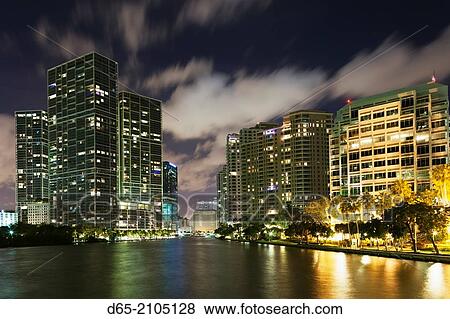 Stock Photo - USA, Florida, Miami, city skyline from Brickell Key, evening.. Fotosearch