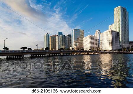 USA, Florida, Miami, city skyline from Brickell Key, dawn. View Large Photo Image Stock Photograph - USA, Florida, Miami, city skyline from Brickell Key, dawn.. Fotosearch