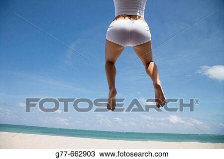 Usa. Florida. Miami. Key Biscayne. Woman on the beach of Crandon Beach. View Large Photo Image Stock Image - Usa. Florida. Miami. Key Biscayne. Woman on the beach of Crandon Beach.. Fotosearch
