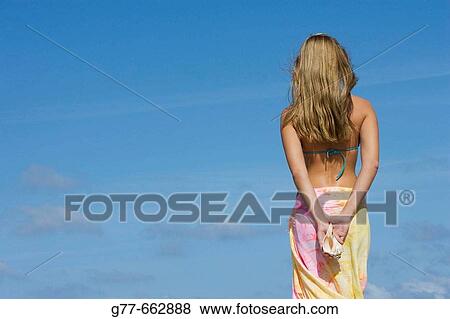 Stock Photo - Usa. Florida. Miami. Key Biscayne. Woman on the beach of Crandon Beach.. Fotosearch