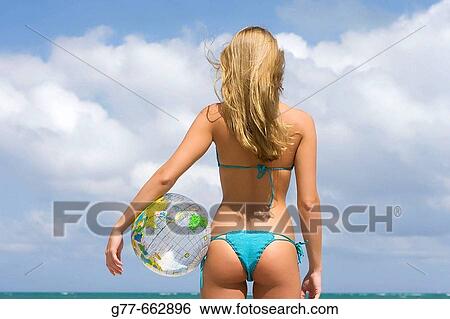 Stock Photograph - Usa. Florida. Miami. Key Biscayne. Woman on the beach of Crandon Beach.. Fotosearch