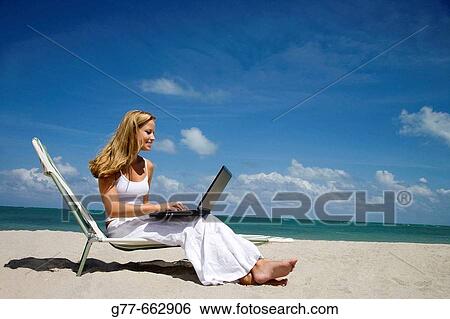Usa. Florida. Miami. Key Biscayne. Woman on the beach of Crandon Beach. View Large Photo Image Stock Photograph - Usa. Florida. Miami. Key Biscayne. Woman on the beach of Crandon Beach.. Fotosearch