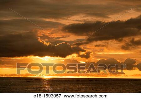 USA, Hawaii, Oahu bright orange sunset over the Pacific viewed from Waikiki beach. View Large Photo Image Stock Photo - USA, Hawaii, Oahu bright orange sunset over the Pacific viewed from Waikiki beach.. Fotosearch