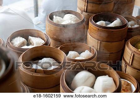 USA, Hawaii, Owahu Honolulu Chinese restaurant with dim sum steamers in the window View Large Photo Image Stock Photo - USA, Hawaii, Owahu Honolulu Chinese restaurant with dim sum steamers in the window. Fotosearch