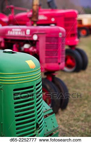 Stock Photo - USA, Manchester Center, antique farm tractors.. Fotosearch