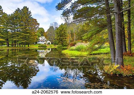 Stock Photograph - USA, Massachusetts, Berkshire District, Near Lee City, House and Pond.. Fotosearch