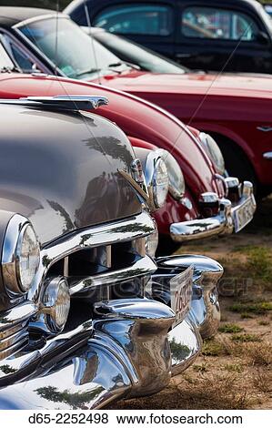 USA, Massachusetts, Gloucester, Antique Car Show, 1950s-era Cadillac and Volkswagen Bug. View Large Photo Image Stock Photo - USA, Massachusetts, Gloucester, Antique Car Show, 1950s-era Cadillac and Volkswagen Bug.. Fotosearch