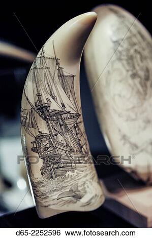 Stock Photograph - USA, Massachusetts, New Bedford, New Bedford Whaling Museum, scrimshaw art, etching on whale bone.. Fotosearch