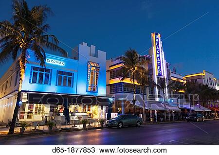 Stock Image - USA, Miami Beach, South Beach, art deco Breakwater Hotel sign, Ocean Drive, dawn. Fotosearch
