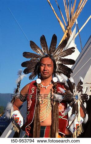 Usa, Native American, Mature man wearing ceremonial dress in front of Teepee View Large Photo Image Picture - Usa, Native American, Mature man wearing ceremonial dress in front of Teepee. Fotosearch