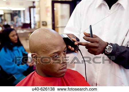 USA. New York City, Harlem. Man getting head shaved at barber shop. View Large Photo Image Stock Photo - USA. New York City, Harlem. Man getting head shaved at barber shop.. Fotosearch