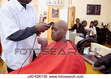USA. New York City, Harlem. Man getting head shaved at barber shop. View Large Photo Image Stock Photo - USA. New York City, Harlem. Man getting head shaved at barber shop.. Fotosearch