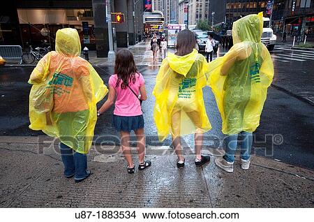 Picture - Usa, New York City, Manhattan, Tourists Standing at the Roadside. Fotosearch