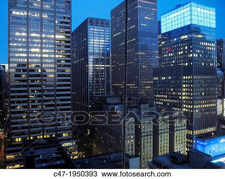 Stock Image - USA. New York city. Midtown buildings at dusk. Fotosearch