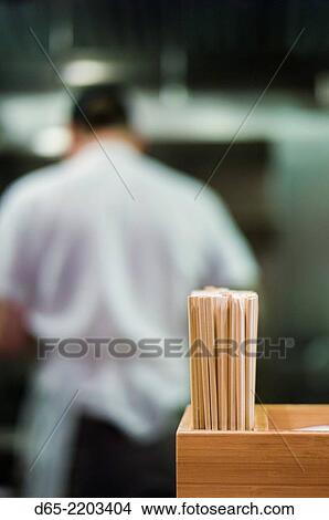 USA, New York, New York City, Lower Manhattan, chef preparing food at David Chang's Momofuku Noodle Bar. View Large Photo Image Picture - USA, New York, New York City, Lower Manhattan, chef preparing food at David Chang's Momofuku Noodle Bar.. Fotosearch