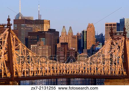USA, New York, Queensboro Bridge, Manhattan skyline viewed from Queens - illuminated at dawn. View Large Photo Image Stock Photography - USA, New York, Queensboro Bridge, Manhattan skyline viewed from Queens - illuminated at dawn.. Fotosearch
