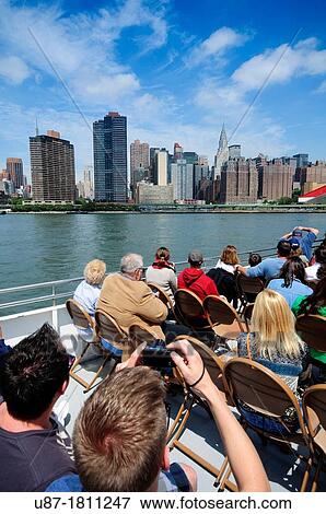 USA, New York, Tourists on Circle Line Tour Boat, Manhattan Skyline View Large Photo Image Stock Photo - USA, New York, Tourists on Circle Line Tour Boat, Manhattan Skyline. Fotosearch