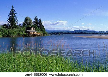 USA, SOUTHWEST WASHINGTON, SKAMOKAWA, COLUMBIA RIVER IN BACKGROUND, CABIN ON WATER. View Large Photo Image Stock Photograph - USA, SOUTHWEST WASHINGTON, SKAMOKAWA, COLUMBIA RIVER IN BACKGROUND, CABIN ON WATER.. Fotosearch