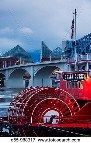 Stock Photo - USA, Tennessee, Chattanooga, Delta Queen riverboat and Market Street bridge, dusk. Fotosearch