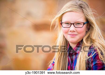 USA, Texas, Portrait of girl (12-13) with long blond hair and glasses View Large Photo Image Stock Image - USA, Texas, Portrait of girl (12-13) with long blond hair and glasses. Fotosearch