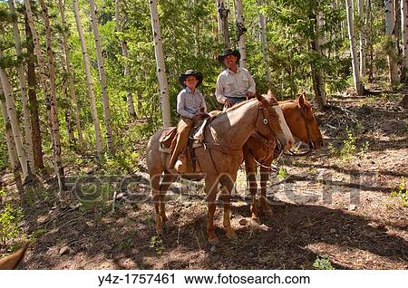 USA, Utah, horseback ride in Escalante with wranglers Jamie Barnson and Cash Barnson through ponderosa pine forest up steep trail to Aquarius Plateau MR View Large Photo Image Stock Image - USA, Utah, horseback ride in Escalante with wranglers Jamie Barnson and Cash Barnson through ponderosa pine forest up steep trail to Aquarius Plateau MR. Fotosearch