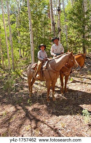 USA, Utah, horseback ride in Escalante with wranglers Jamie Barnson and Cash Barnson through ponderosa pine forest up steep trail to Aquarius Plateau MR View Large Photo Image Stock Image - USA, Utah, horseback ride in Escalante with wranglers Jamie Barnson and Cash Barnson through ponderosa pine forest up steep trail to Aquarius Plateau MR. Fotosearch