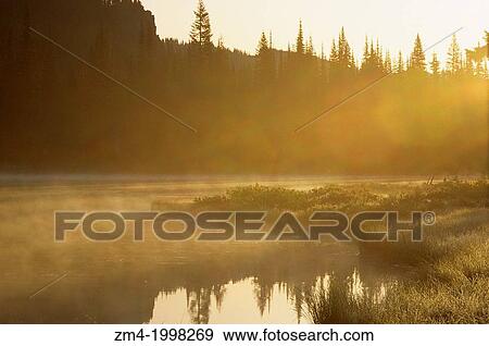 USA, WASHINGTON, MOUNT RAINIER NATIONAL. PARK, REFLECTION LAKES, FOG RISING AT SUNRISE. View Large Photo Image Stock Photo - USA, WASHINGTON, MOUNT RAINIER NATIONAL. PARK, REFLECTION LAKES, FOG RISING AT SUNRISE.. Fotosearch