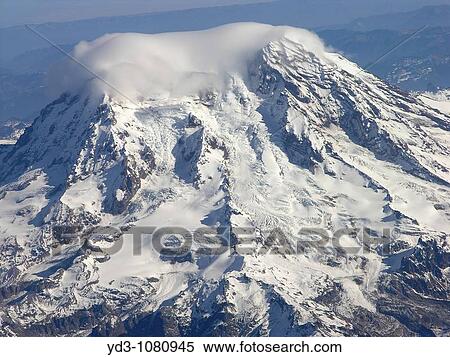 USA, Washington State, cloud hovering above snow covered Mount Rainier, aerial view View Large Photo Image Stock Photography - USA, Washington State, cloud hovering above snow covered Mount Rainier, aerial view. Fotosearch