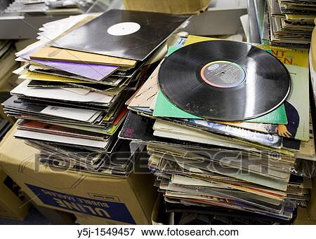Used vinyl records stacked up for resale View Large Photo Image Stock Photo - Used vinyl records stacked up for resale. Fotosearch