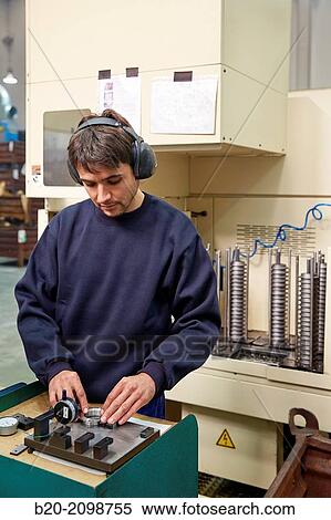 Stock Photography - Useful check dimensions. Automated CNC lathe. Machined Indecober. Machining of precision parts in series. Automotive industry. Berriz. Bizkaia. Basque Country. Spain.. Fotosearch