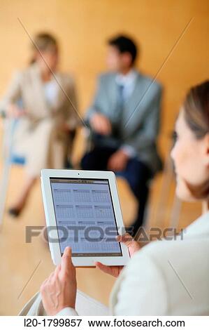 Stock Photo - Using digital tablet. Fotosearch