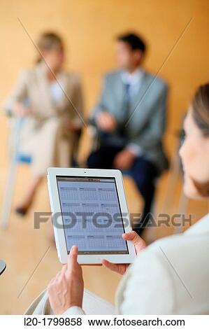 Stock Photo - Using digital tablet. Fotosearch