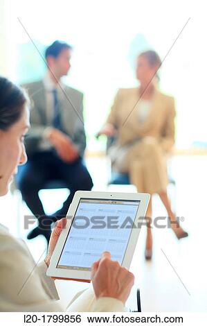 Using digital tablet View Large Photo Image Stock Photograph - Using digital tablet. Fotosearch